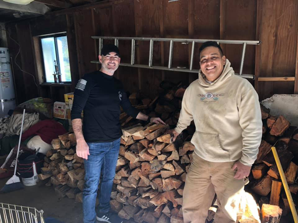 Owner of Action Whitewater Adventures Mike Juarez donating firewood to a veteran in need.